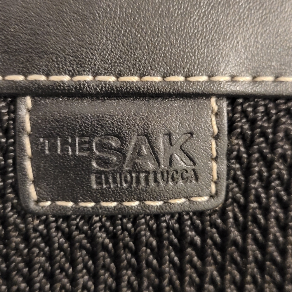 The Sak Elliott Lucca bag NWOT.  Leather straps and solid leather bottom.